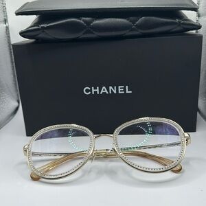 Gold CHANEL glasses with diamonds